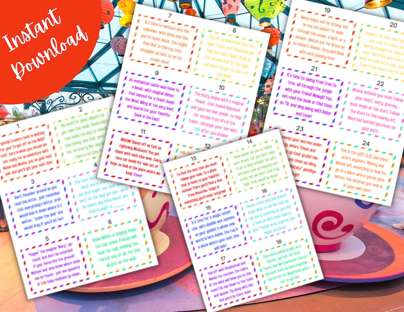 May include: A set of 24 colourful cards with numbers and text. The cards are printed with a variety of Disney characters and themes. The cards are arranged in a grid pattern on a table with a teacup and saucer in the background.