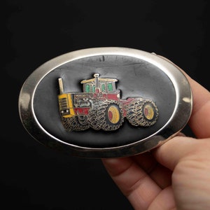 Vintage Oval Versatile Tractor Belt Buckle - Silver Tone with Black Background