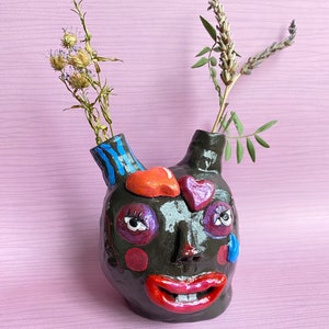 Handmade and hand painted black clay “Happy-sad black heart” monster small vase
