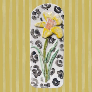 Handcrafted leopard print daffodil floral tile wall hanging