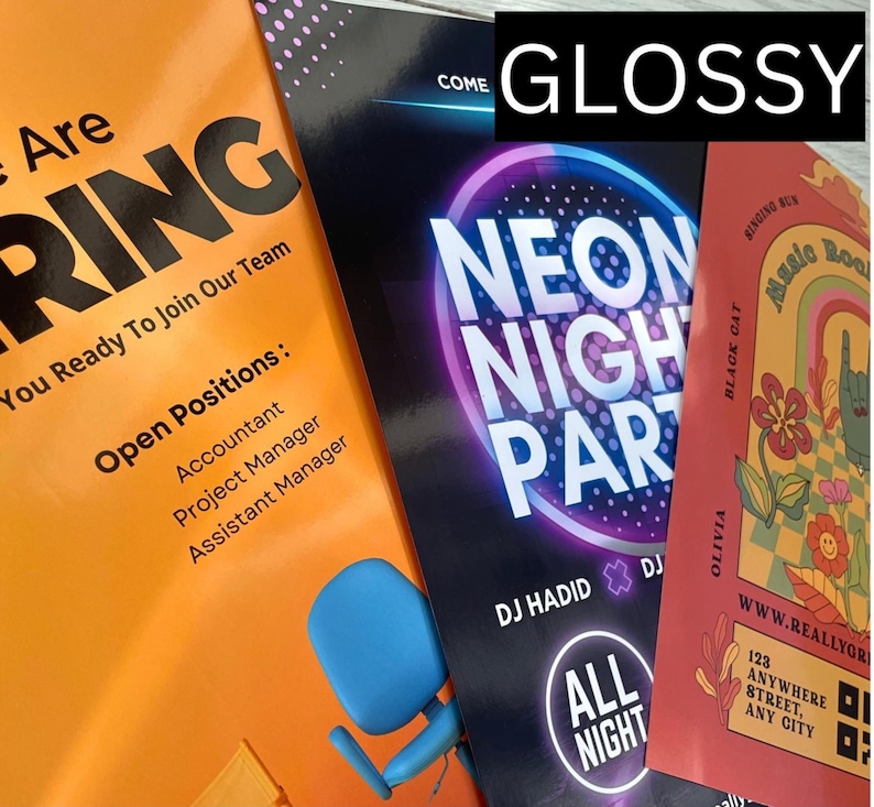 May include: A stack of glossy flyers with bold text and graphics. One flyer is orange and advertises open positions for Accountant, Project Manager, and Assistant Manager. Another flyer promotes a Neon Night Party with DJ Hadid. A third flyer is red and features a floral design.