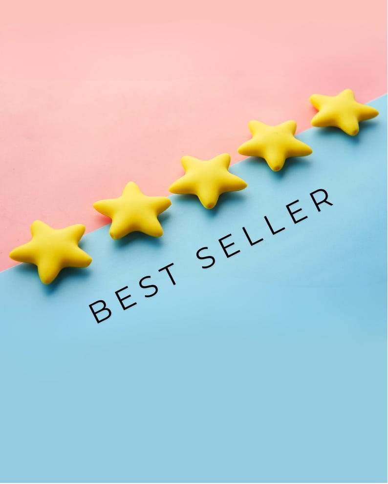 May include: Five yellow star-shaped objects arranged diagonally on a two-tone background. The background is split diagonally, with pink on top and blue on the bottom. The words "BEST SELLER" are printed in black.