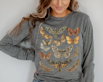 May include: A heather gray long-sleeve shirt with a vintage illustration of various moths and butterflies in shades of brown, yellow, and orange.