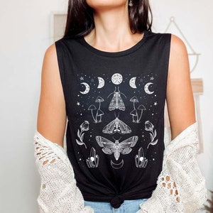 May include: Black sleeveless tank top with a white graphic print of moths, mushrooms, crystals, and moons.