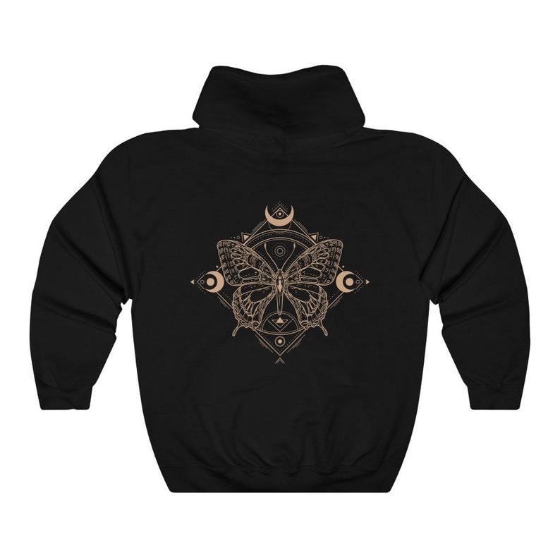 May include: Black hooded sweatshirt with a geometric design featuring a butterfly and crescent moons in a beige color.
