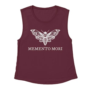 May include: A maroon sleeveless muscle tank top with a white skull moth graphic and the text "MEMENTO MORI" printed on the front.