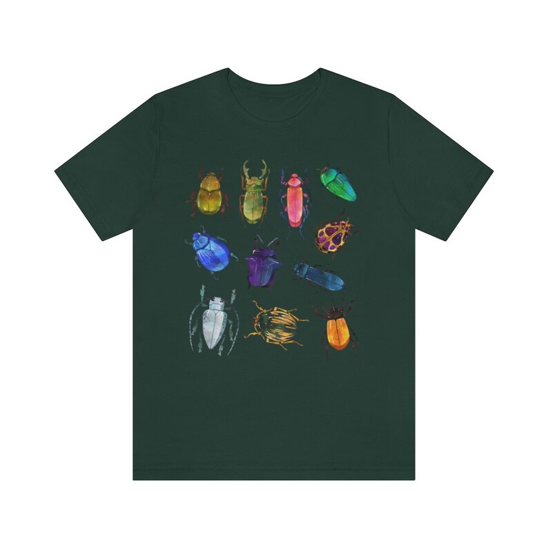May include: A dark green t-shirt with a colorful design of various beetles and insects. The insects are drawn in a watercolor style and include a variety of colors, including blue, green, red, yellow, and orange.