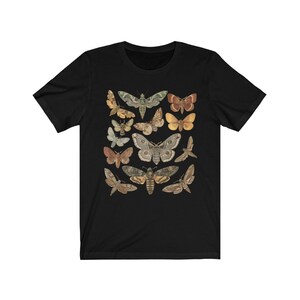 May include: Black t-shirt with a vintage illustration of various moths in shades of brown, green, and yellow.