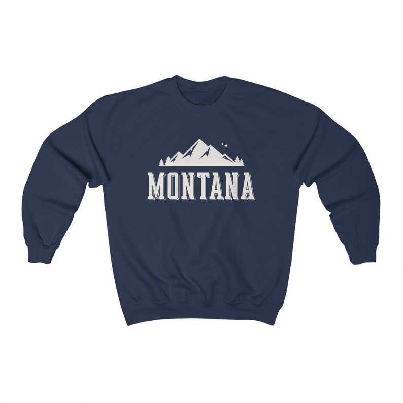 May include: Navy blue sweatshirt with a white mountain graphic and the text "MONTANA" in white.