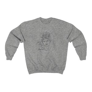 May include: Gray sweatshirt with a line drawing of a person with plants growing out of their head. The text "grow where you are planted" is below the drawing.