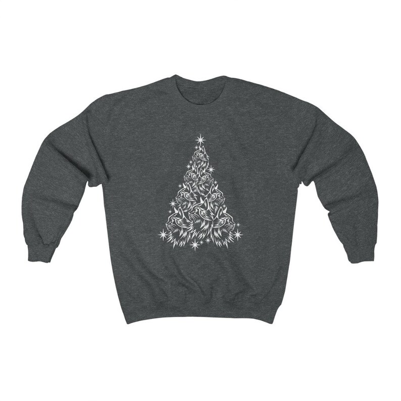 May include: A dark grey sweatshirt featuring a white design of a Christmas tree made up of cat faces. The tree has a star on top and is surrounded by small white stars.