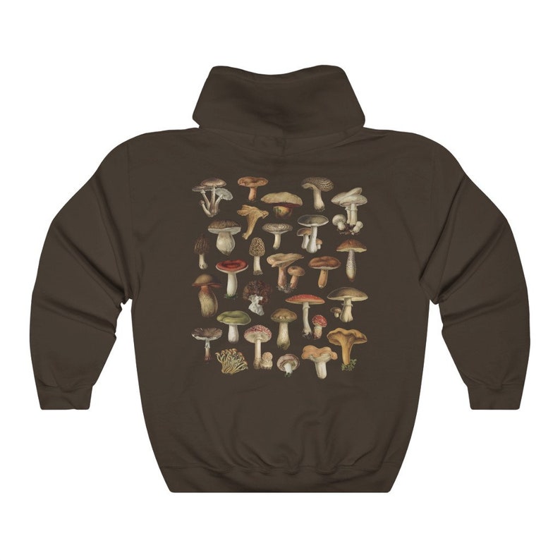May include: A brown hoodie featuring a detailed illustration of various mushrooms in shades of brown, red, and green. The design is centered on the back of the hoodie. The hoodie has a hood and long sleeves.