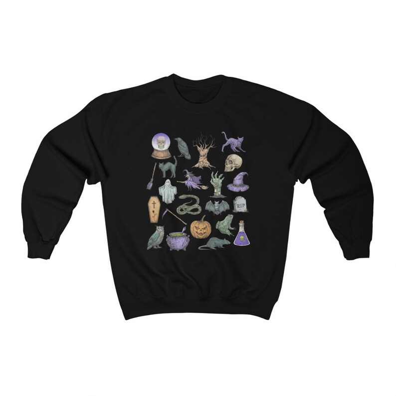 May include: Black sweatshirt with a white and purple print of various Halloween icons, including a ghost, a cat, a pumpkin, a cauldron, a snake, a bat, a crow, a skull, a tree, a witch's hat, a crystal ball, a coffin, a potion bottle, a broom, a hand, and a rat.