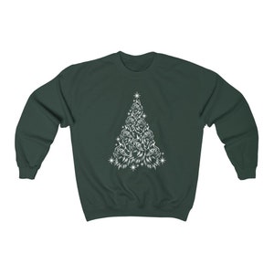 May include: A dark green sweatshirt featuring a white outline of a Christmas tree made from cat faces.