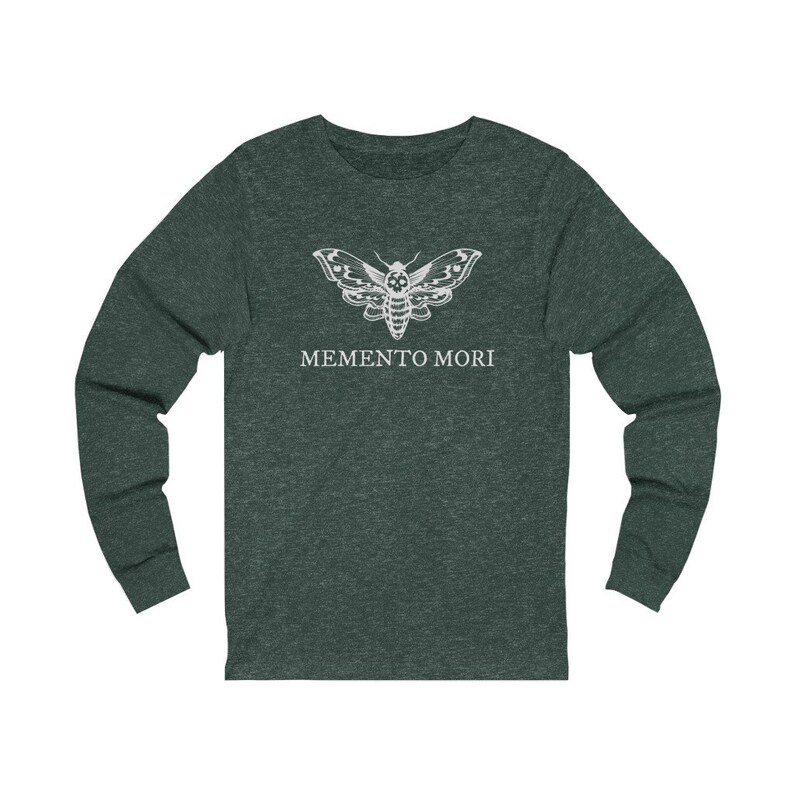May include: A dark green long-sleeved t-shirt featuring a white moth graphic and the text "MEMENTO MORI" printed on the front.
