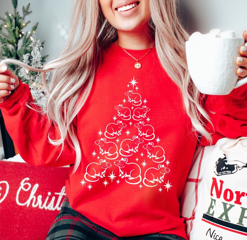 May include: Red Christmas sweatshirt with a white design of a Christmas tree made of rats. The tree is decorated with white stars.
