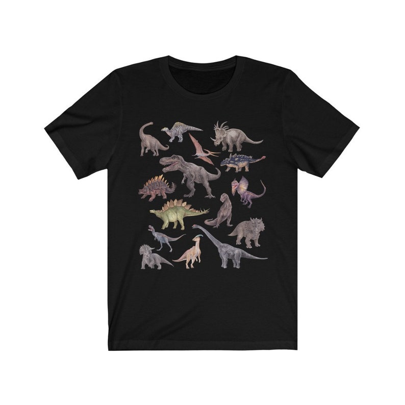 May include: Black t-shirt with a colorful illustration of various dinosaurs. The dinosaurs are arranged in a random pattern on the shirt.