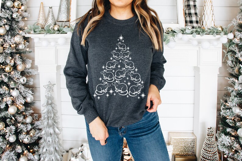 May include: A dark gray sweatshirt with a white design of a Christmas tree made of rats. The tree is decorated with stars.