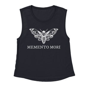 May include: A black sleeveless shirt with a white skull moth graphic and the text "MEMENTO MORI" printed on the front.