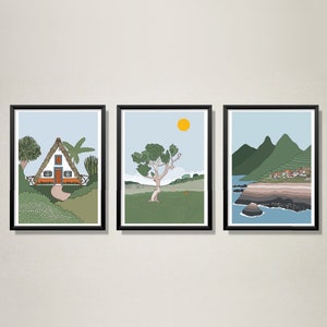 May include: Three framed illustrations of a landscape with a house, a tree, and a mountain range. The house is white with a thatched roof and a red door. The tree is green and has a brown trunk. The mountains are blue and green. The illustrations are all in a minimalist style.