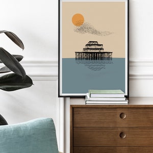 May include: A minimalist black and white illustration of a pier with a large orange sun and a flock of birds flying overhead. The background is a light beige color and the water is a light blue.