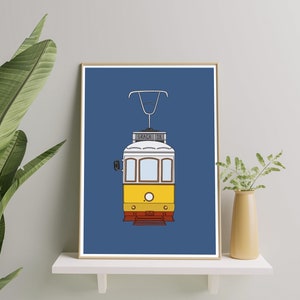 May include: A blue and yellow illustration of a vintage tram with the word "Gra&ccedil;a" and the number "28" on the front.