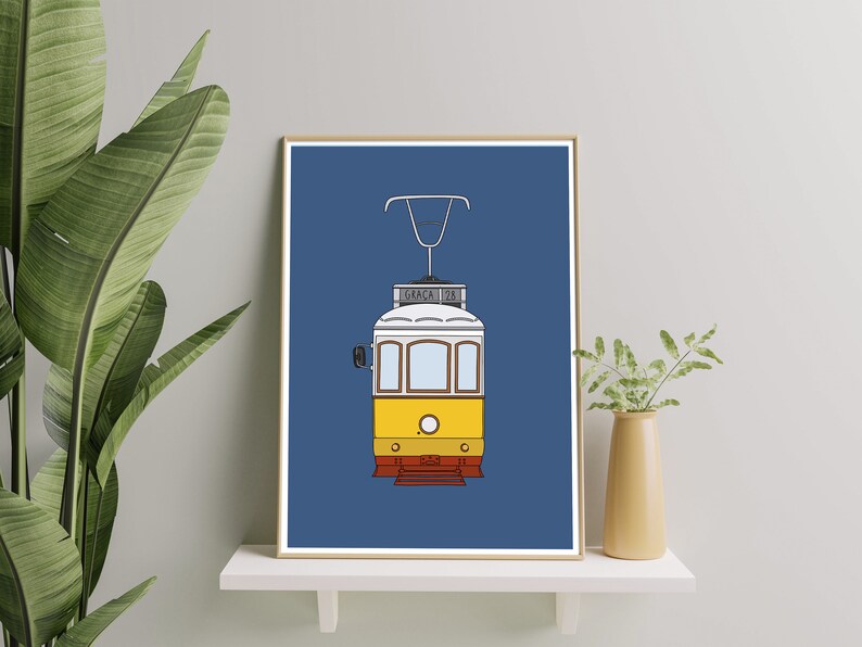 May include: A blue and yellow illustration of a vintage tram with the word "Gra&ccedil;a" and the number "28" on the front.