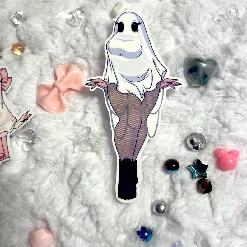 May include: A white ghost wearing a white sheet with black boots and fishnet stockings. The ghost has a large, round head with black eyes and a wide smile.