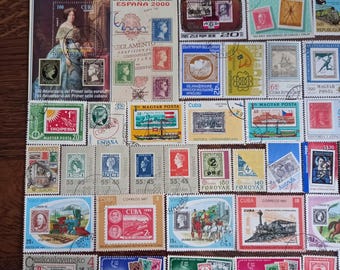 May include: A collection of assorted postage stamps from various countries including Cuba, Spain, Hungary, and Czechoslovakia. The stamps feature diverse imagery such as trains, historical figures, landscapes, and text like España 2000.