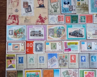 May include: A collection of various international postage stamps featuring diverse illustrations including trains, animals, historical figures, and landscapes, arranged in a grid pattern on a light background with some stamps showing text.