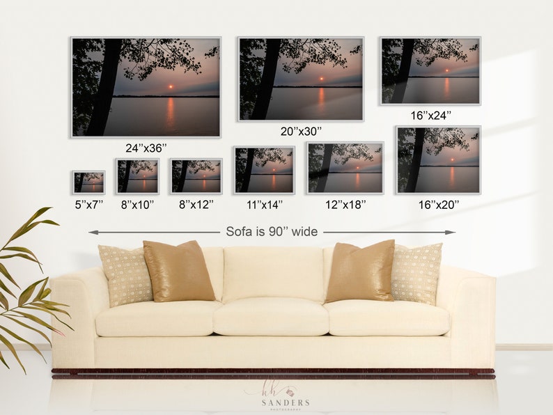 May include: A collage of eight different sizes of a photograph of a sunset over a lake. The photo shows a silhouette of trees in the foreground and a bright orange sun setting over the water. The caption below the images reads "Sofa is 90" wide".