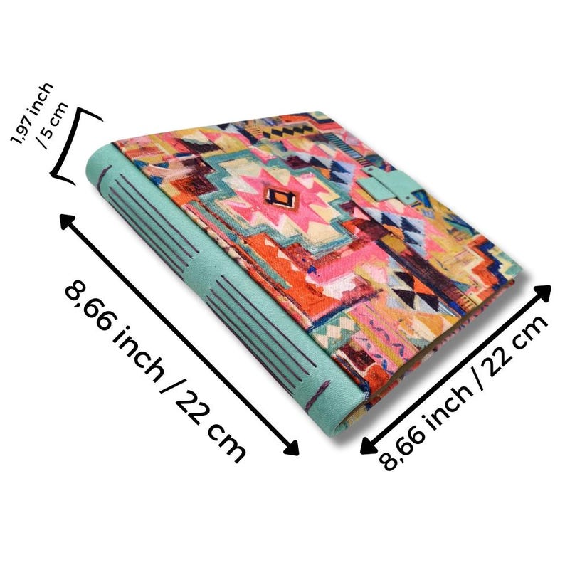 May include: A colorful journal with a geometric pattern in pink, orange, and blue. The journal is 8.66 inches (22 cm) long and 1.97 inches (5 cm) thick. The cover has a turquoise spine and a matching clasp.