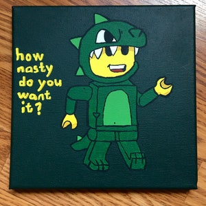 May include: A square canvas painting depicting a Lego figure in a green dinosaur costume. The figure has a yellow head and hands. Yellow text reads "how nasty do you want it?" against a dark green backdrop.