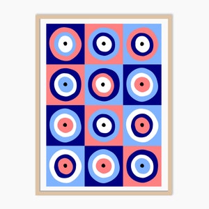 May include: A framed print with a geometric pattern of blue, pink, and white circles. The circles have a concentric design with a black dot in the center.