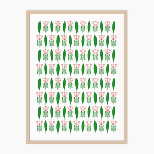May include: A framed print featuring a repeating pattern of stylized red flowers and green leaves on a white background. The flowers have a simple, linear design, and the leaves are long and slender. The frame is a light brown color.