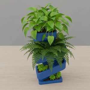 May include: A three-tiered, blue planter filled with various green plants. The top tier holds a leafy plant with heart-shaped leaves, the middle tier has ferns, and the bottom tier contains small succulents. The planter has a unique, spiral design.