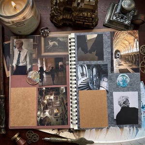 May include: A spiral-bound scrapbook featuring various photographs of a castle interior, a person in a white shirt and tie, and a person in a black coat. The pages include blank brown paper rectangles, two circular wax seals, and a gray textured background.