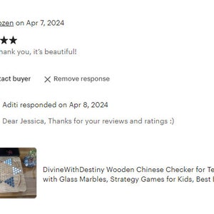 May include: A wooden Chinese checkers game board with glass marbles. The board is made of light brown wood and has a star-shaped design. The marbles are blue, green, and red.