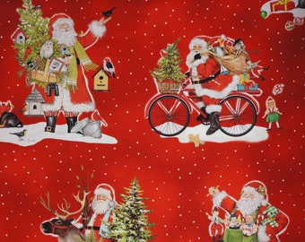 Santa Riding a Bike, Santa with Presents in Red Mary Lake-Thompson by Robert Kaufman Fabrics Quilting Cotton Fabric AMKD204853