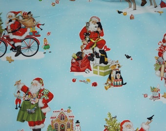 Santa Riding a Bike, Santa with Presents in Blue Mary Lake-Thompson by Robert Kaufman Fabrics Quilting Cotton Fabric AMKD204854