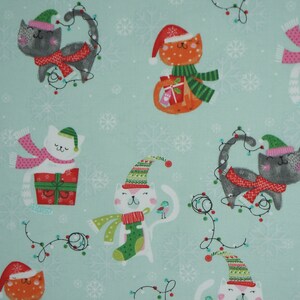 Cats with Presents and Christmas Lights on Light Green Christmas Novelty Cotton Fabric