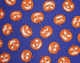 Glow in the Dark Pumpkin Faces on Purple by Lewis and Irene Halloween Quilting Cotton Fabric, Jack O'Lantern A601.2