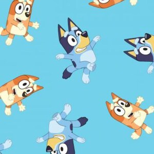 May include: A light blue fabric pattern featuring repeating cartoon illustrations of Bluey and Bingo in various active poses. The characters are depicted in shades of blue, orange, and cream with expressive faces, set against a solid light blue background.
