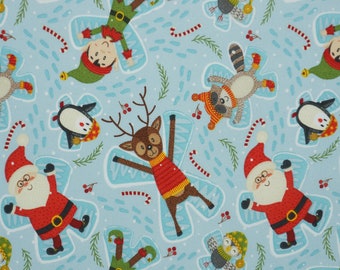 Christmas Snow Angels on light blue Novelty Cotton Fabric, Elf Snow Angel, Reindeer Snow Angel, Racoon Snow Angel, Santa Snow Angel