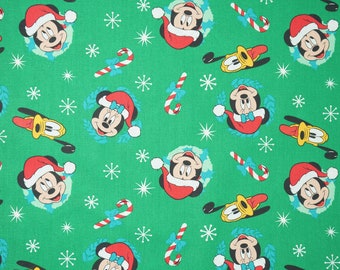 Mickey Minnie and Pluto Head Toss with Candy Canes on Green  by Springs Creative Disney Licensed Novelty Cotton Fabric