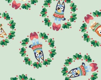 Bluey Christmas Fabric, Bluey and Bingo Wreaths on Light Green Licensed by Ludo Studios for Springs Creative Novelty Cotton Fabric