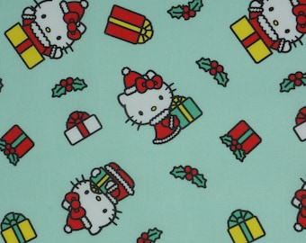 Hello Kitty Christmas Fabric, Hello Kitty Christmas Presents on Green Novelty Cotton Fabric, Sanrio Licensed by Springs Creative