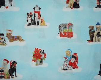 Cute Christmas Dogs and Cats dressed in Pajamas, Making Snowmen on Light Blue, by Robert Kaufman Fabrics Quilting Cotton Fabric