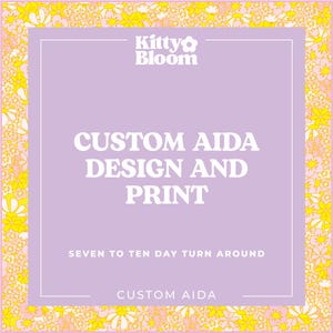 The image is a promotional poster for a brand called "Custom Aida Design and Print". It features a purple background with a floral pattern and white text. The text highlights the brand's custom design and print services, offering a seven to ten day turnaround.