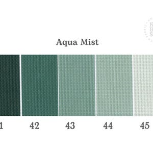 May include: A colour palette chart labelled Aqua Mist featuring five swatches of fabric with a woven texture, ranging from dark forest green to pale mint green. The swatches are numbered 41, 42, 43, 44, and 45, with the Kitty Bloom Studio logo visible.